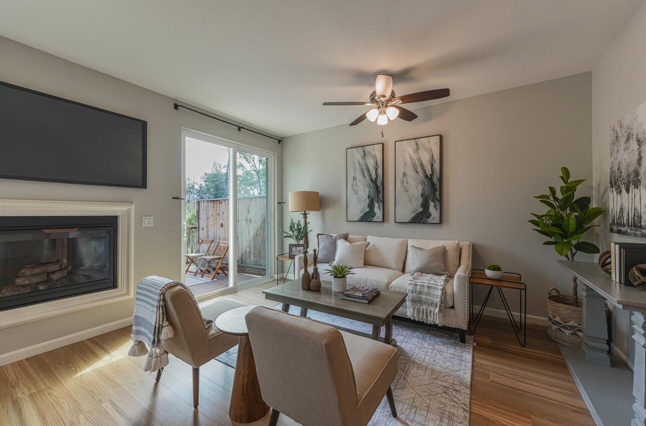 145 Atherton Loop Aptos, CA 95003 - Photo 9 of 47 a living room with furniture a flat screen tv and a fireplace