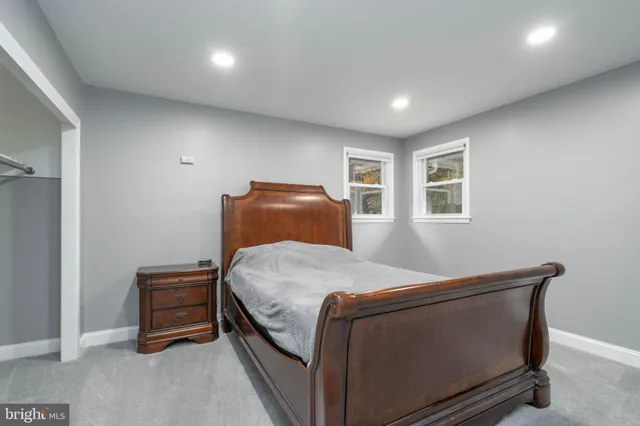 a bedroom with a bed and closet