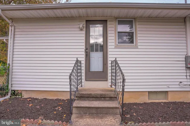 a view of a house with a door and a window