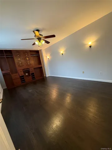 a bathroom with a granite countertop toilet a sink and a bathtub