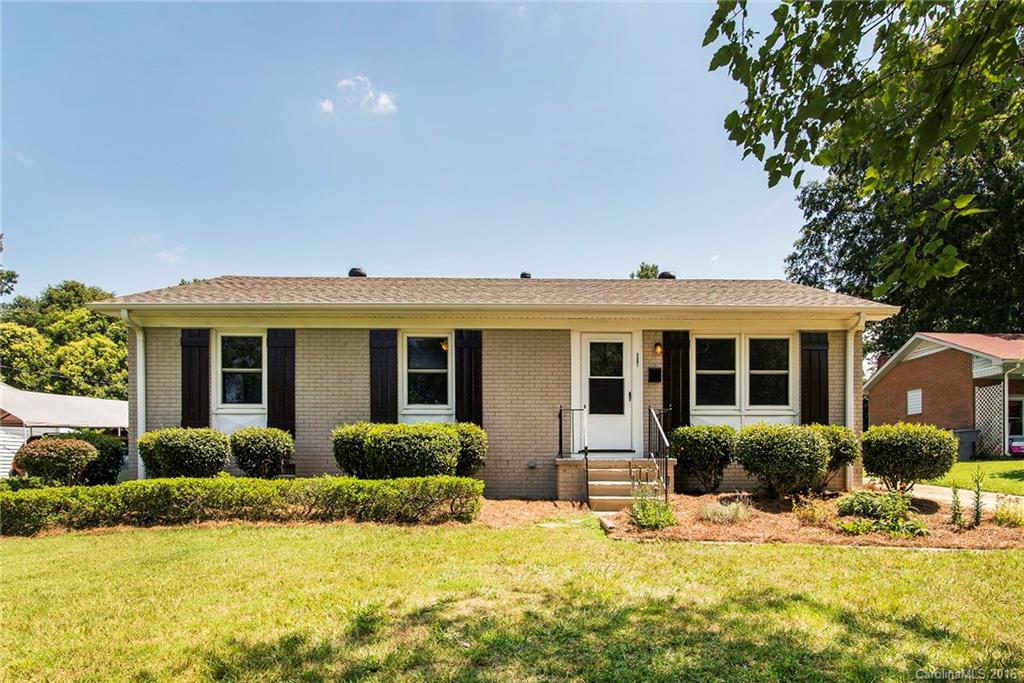 4209 Woodleaf Road Charlotte, NC 28205 - Photo 1 of 18 a front view of house with yard and green space