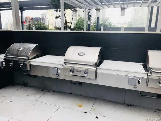 a living room with furniture and large windows