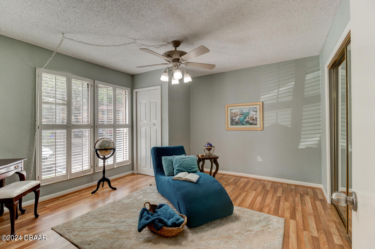 13 Glen Arbor Park Ormond Beach, FL 32174 - Photo 3 of 35 a living room with furniture and a large window