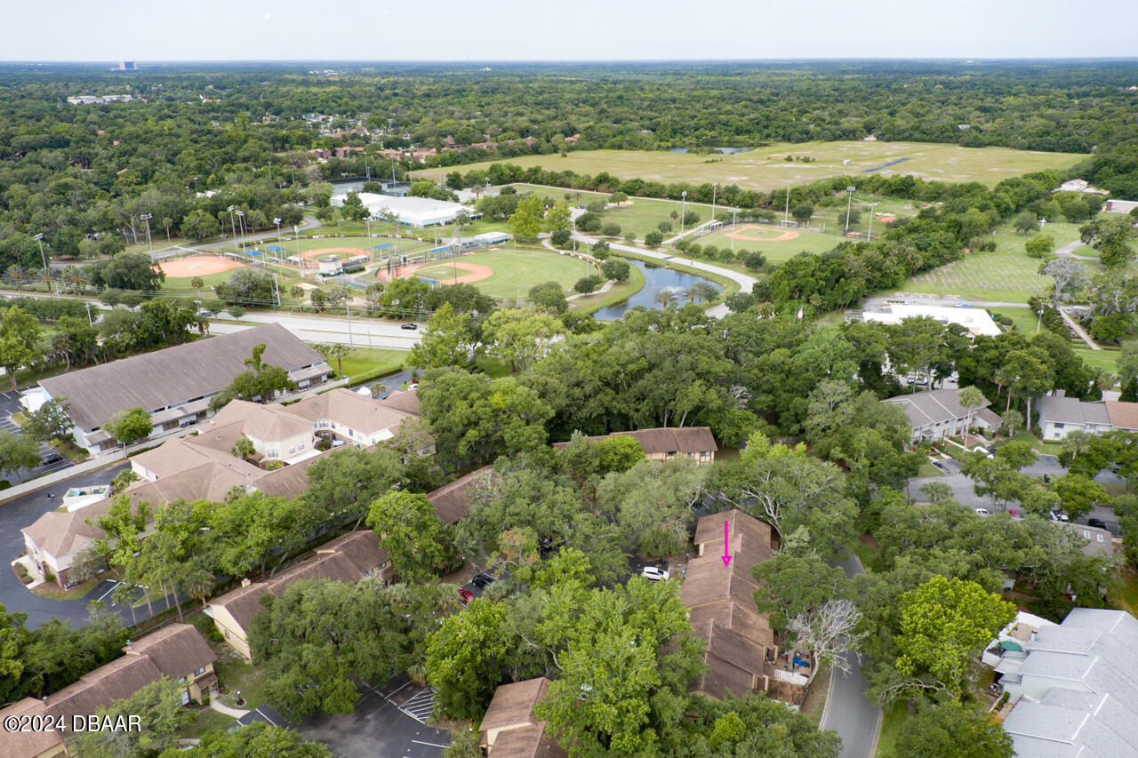 13 Glen Arbor Park Ormond Beach, FL 32174 - Photo 31 of 35 an aerial view of residential houses with outdoor space and trees