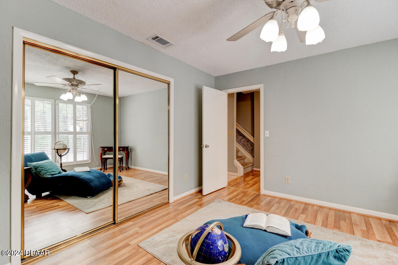 13 Glen Arbor Park Ormond Beach, FL 32174 - Photo 4 of 35 a living room with furniture and a wooden floor