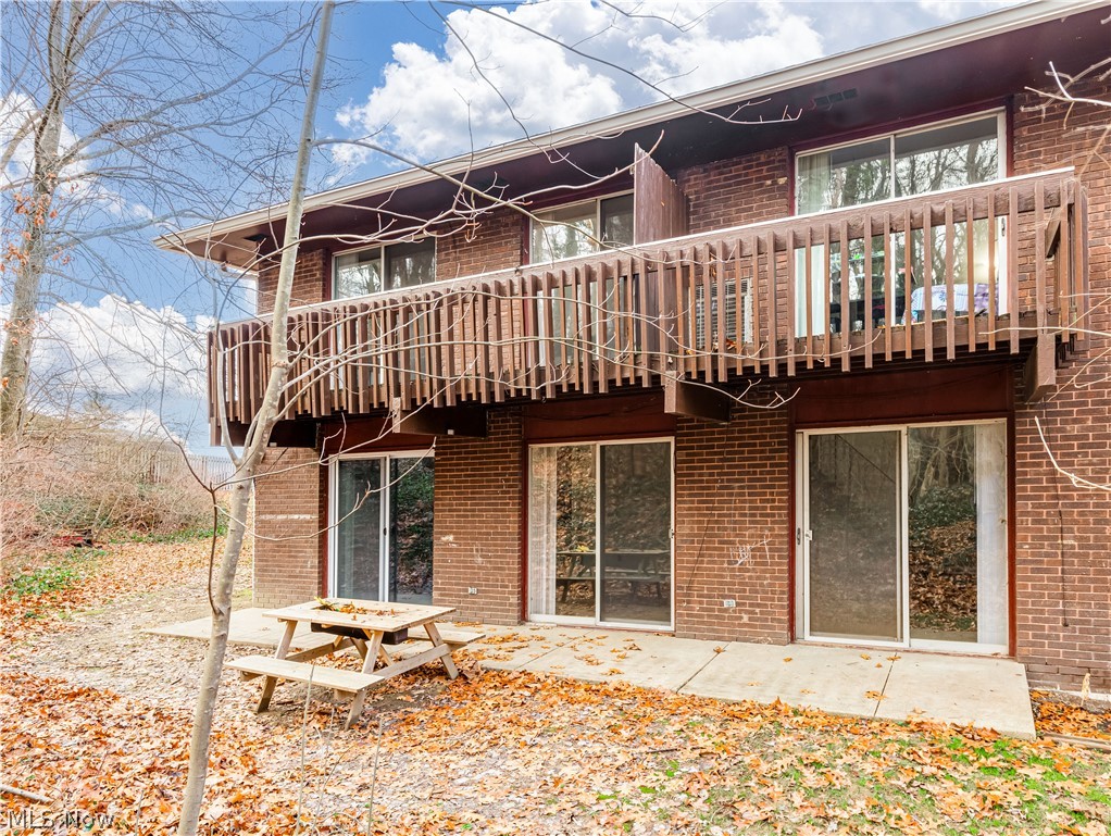 2550 Chamberlain Road, Unit A3 Akron, OH 44333 - Photo 2 of 21 Rear view of house with a balcony