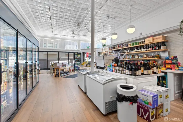 a open kitchen with a sink and breakfast area