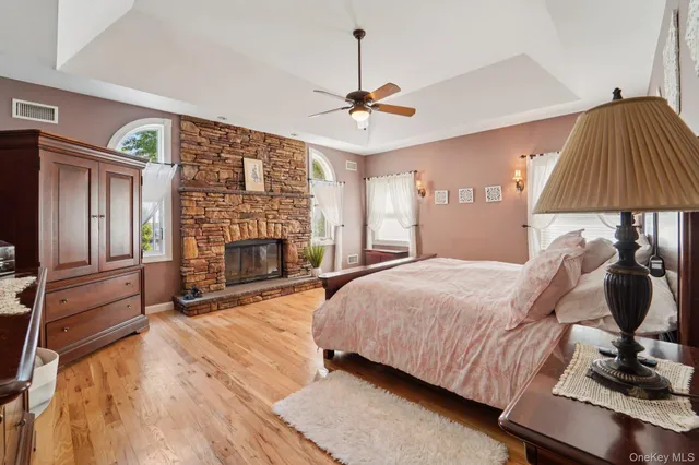 a bedroom with a bed and a fireplace