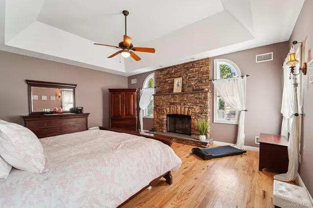 a bedroom with a bed and a fireplace