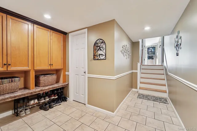 a view of an entryway with wooden floor