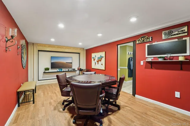 a dining room with furniture window and wooden floor