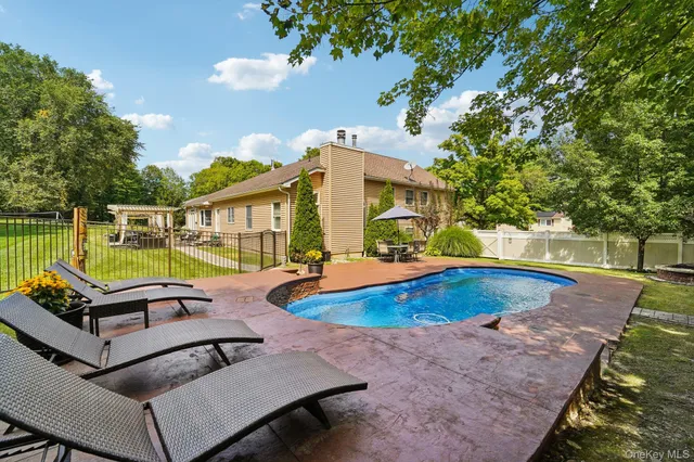 swimming pool with outdoor seating
