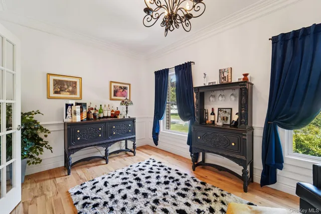 a bedroom with furniture and a window