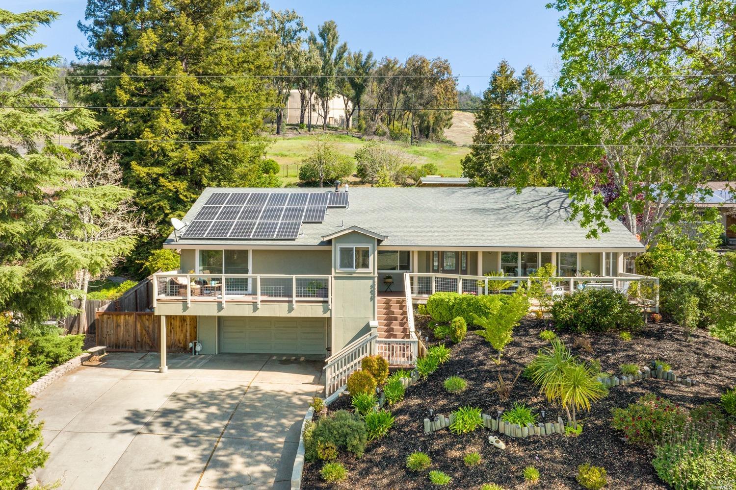 front view of a house with a garden