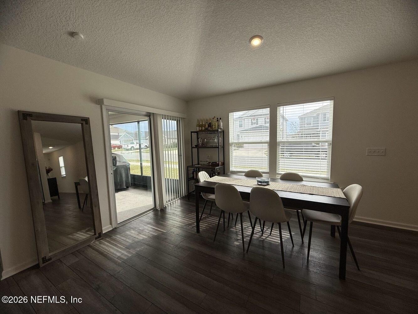 8161 Lumber Way Jacksonville, FL 32222 - Photo 9 of 13 a view of a dining room with furniture and wooden floor