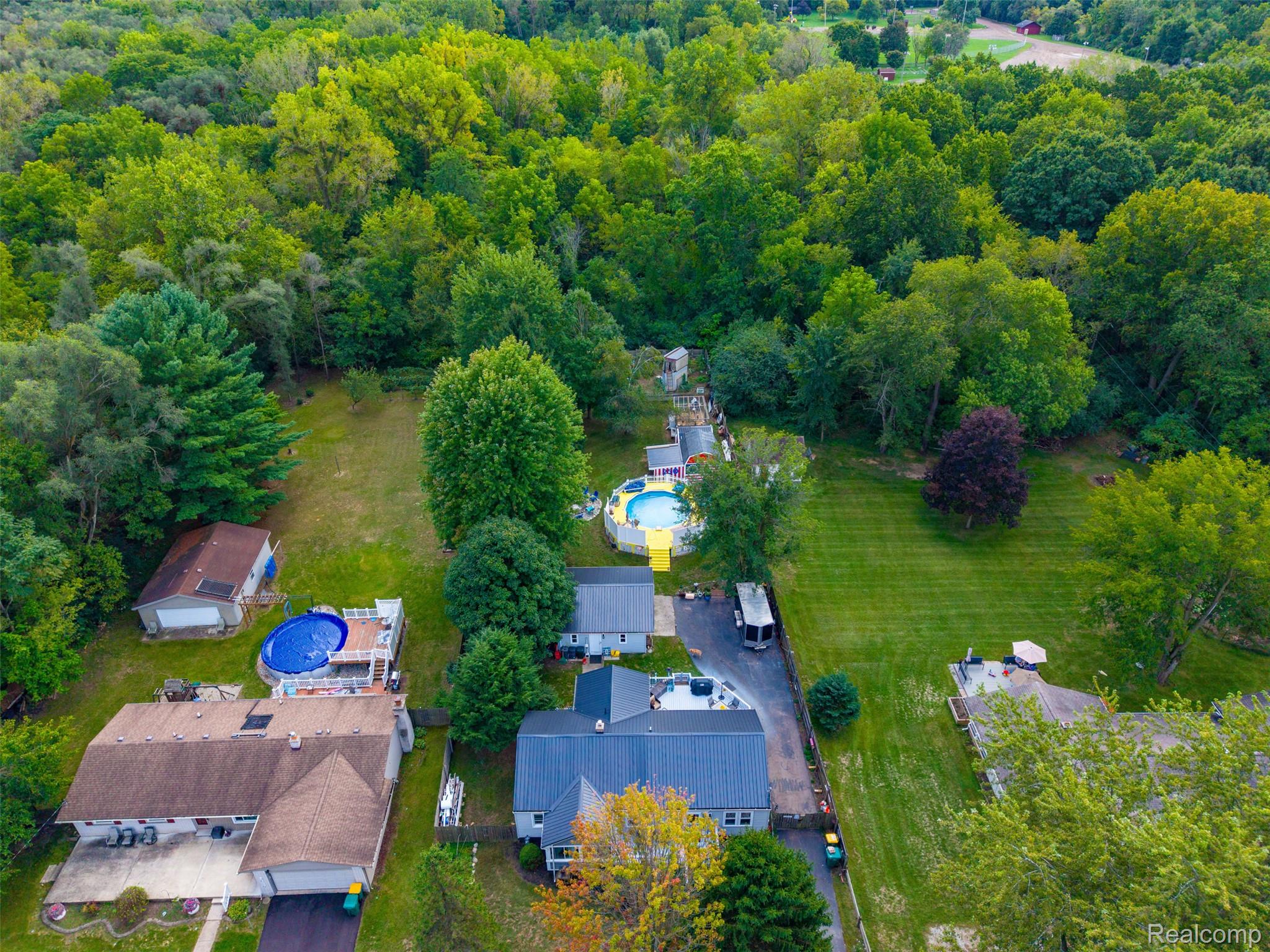 36739 Wick Road Romulus, MI 48174 - Photo 41 of 56 Expansive green space and mature trees enhance the property