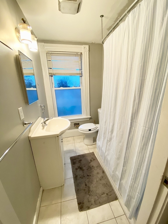 12 Highland Avenue, Unit 2 Beverly, MA 01915 - Photo 6 of 7 a bathroom with a sink and a mirror