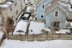 12 Highland Avenue, Unit 2 Beverly, MA 01915 - Photo 7 of 7 a front view of a house with a yard
