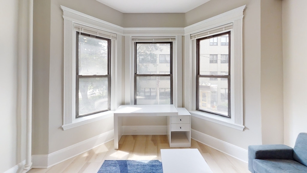 41 Edgerly Road, Unit 26 Boston, MA 02115 - Photo 3 of 9 a bathroom with a toilet a sink and a bathtub
