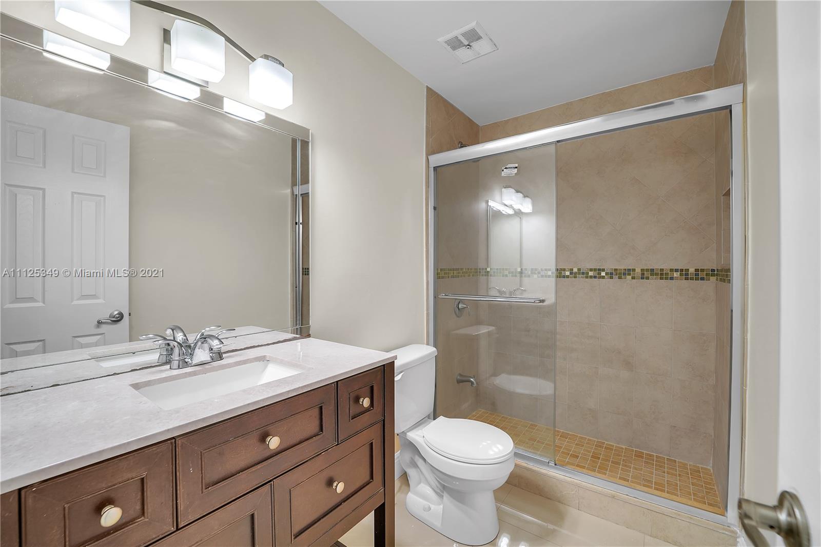 The Crossings Miami, FL 33186 - Photo 21 of 31 a bathroom with a double vanity sink toilet and shower