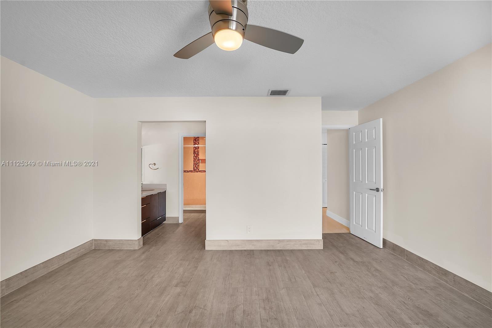 The Crossings Miami, FL 33186 - Photo 7 of 31 a view of empty room with wooden floor