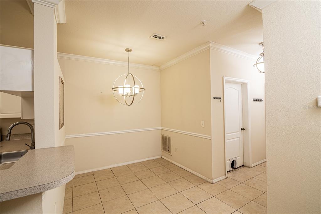 3391 South Kirkman Road, Unit 1216 Orlando, FL 32811 - Photo 4 of 33 a bathroom with a sink and a shower
