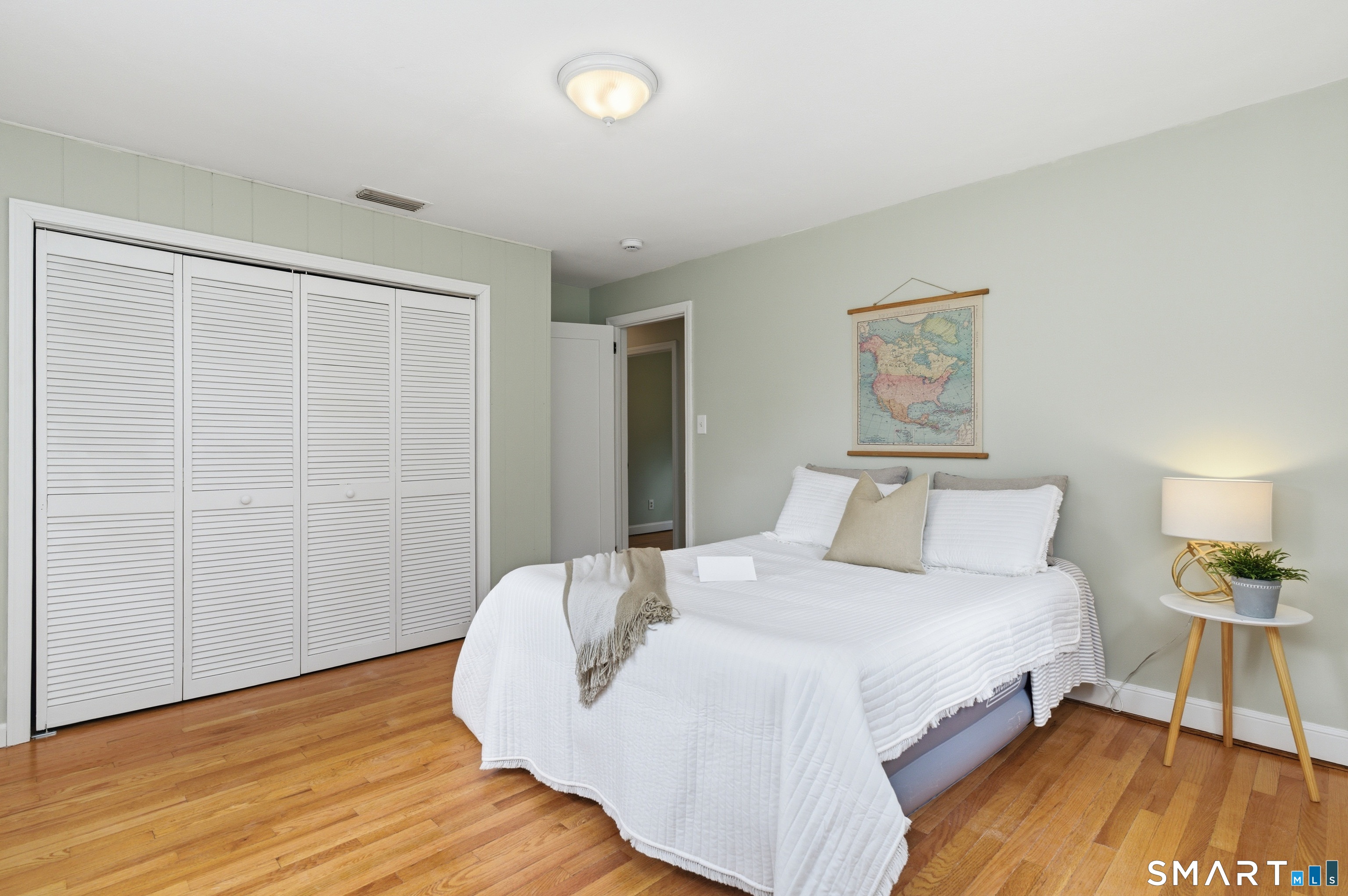 149 Mill Street Wethersfield, CT 06109 - Photo 12 of 29 a bedroom with a bed and a table