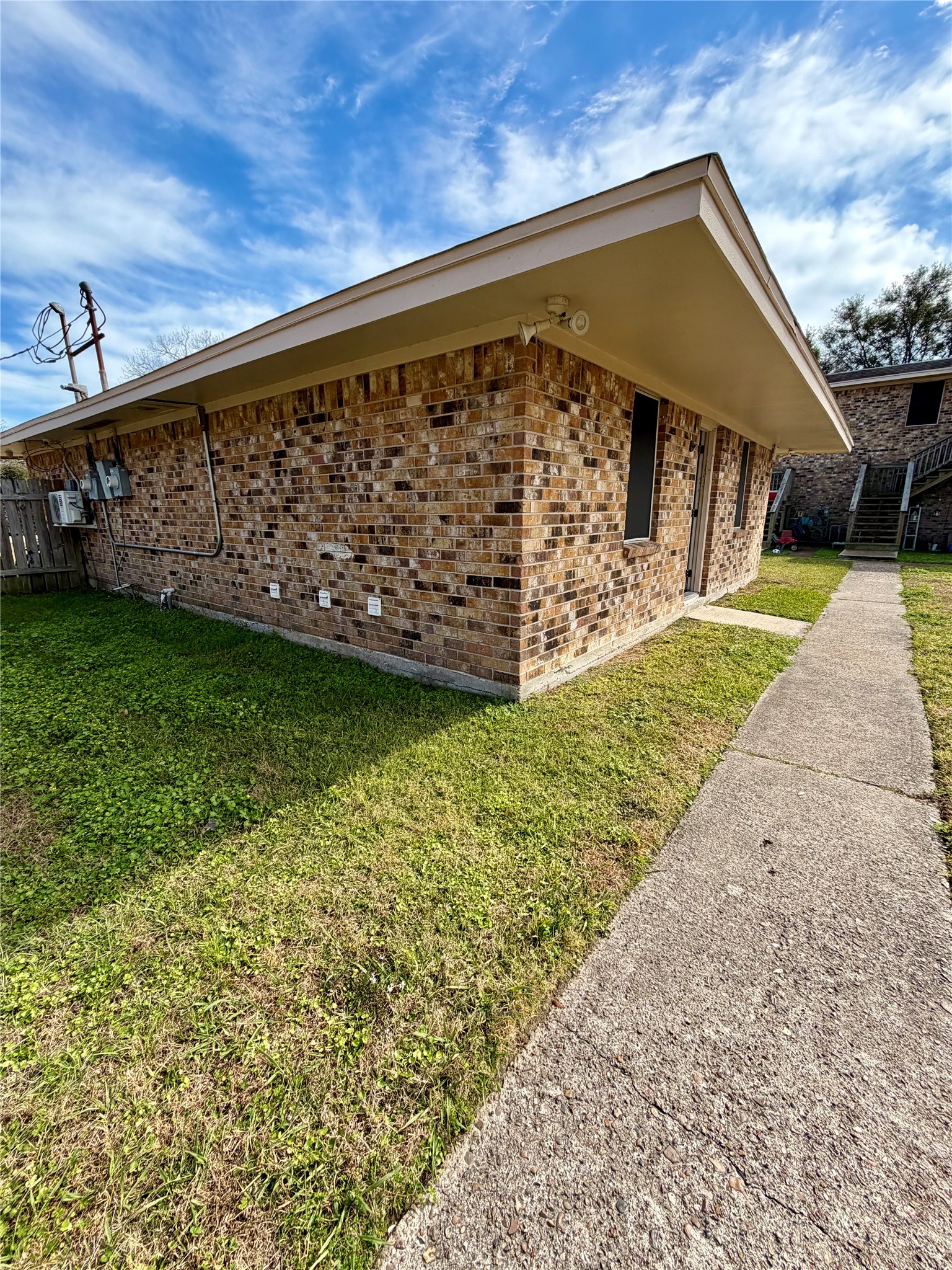 1614 Vauthier Street, Unit 3 La Marque, TX 77568 - Photo 13 of 13 a view of a backyard with a garden