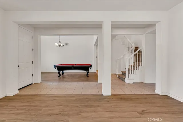 a view of a livingroom with a fireplace and window