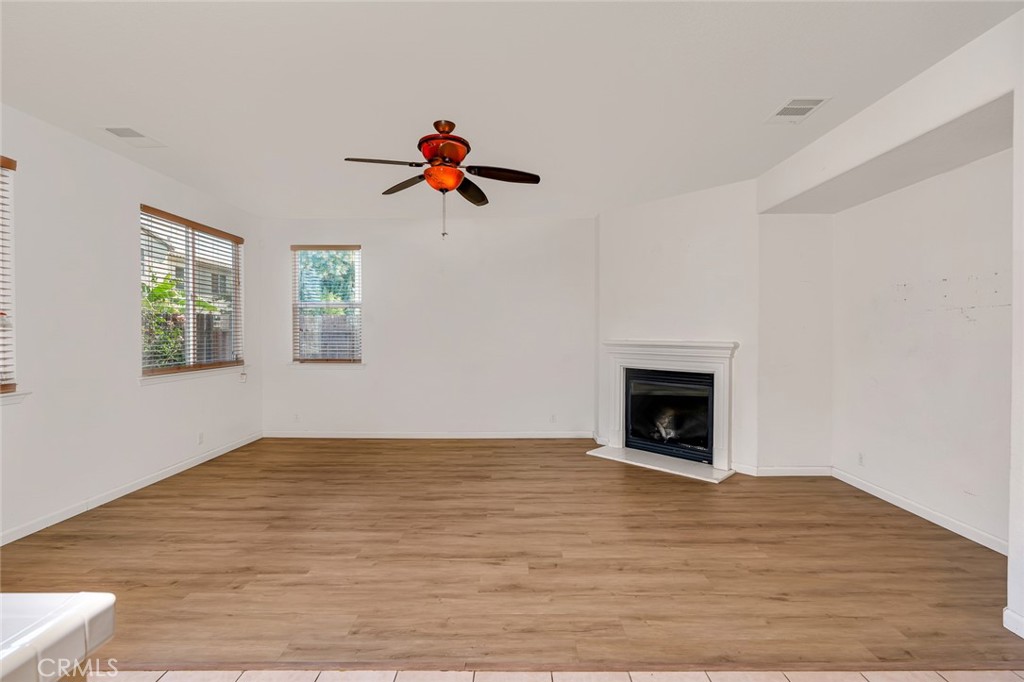 1289 Verdon Court Merced, CA 95348 - Photo 13 of 56 a view of a livingroom with a fireplace and window