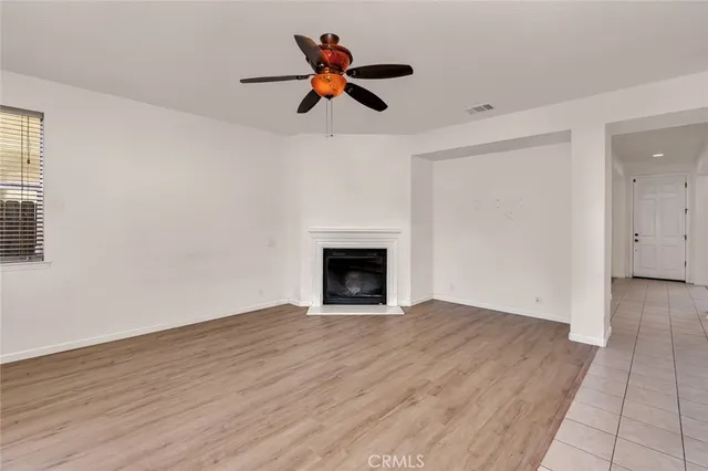 a large kitchen with stainless steel appliances kitchen island granite countertop a sink and cabinets