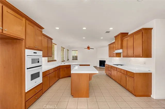 a view of a living room and kitchen view