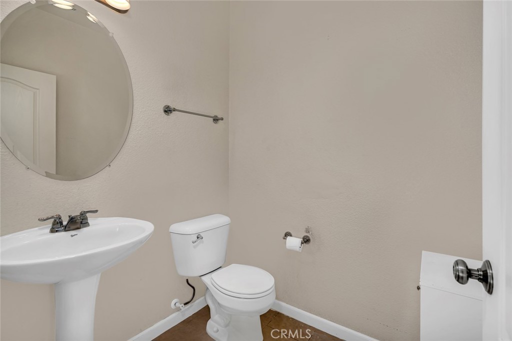 1289 Verdon Court Merced, CA 95348 - Photo 24 of 56 a bathroom with a sink and a toilet
