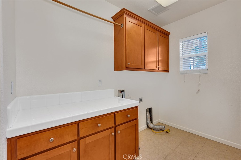 1289 Verdon Court Merced, CA 95348 - Photo 38 of 56 a bathroom with a sink and a washing machine