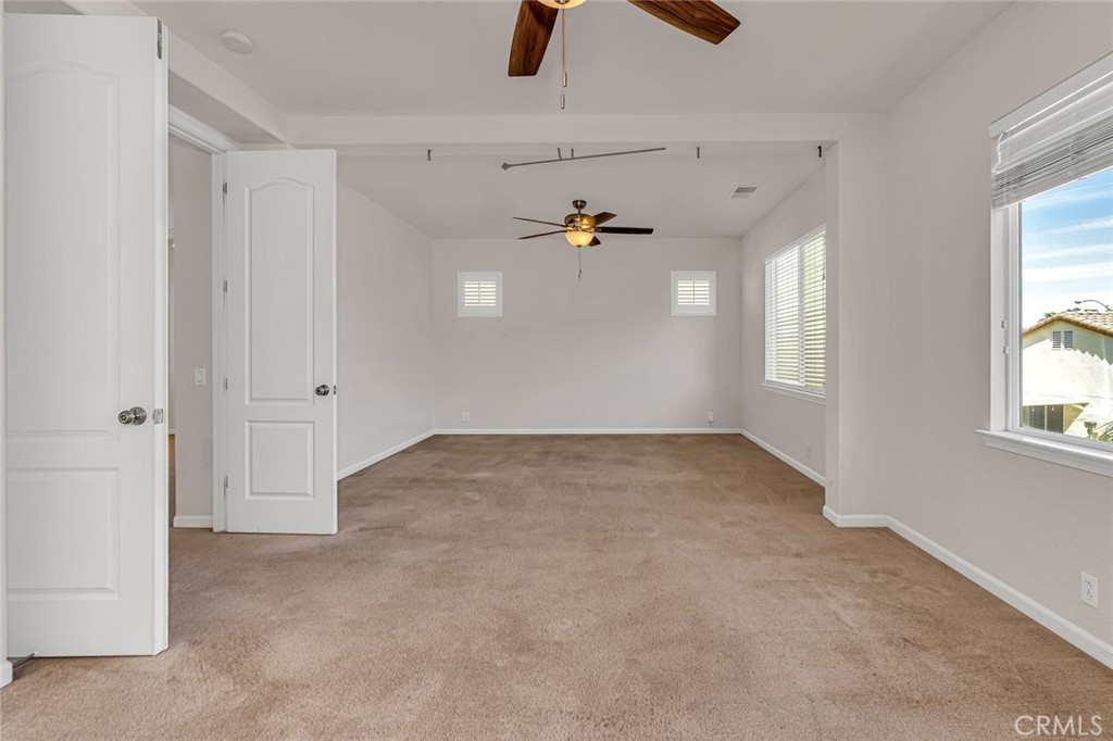 1289 Verdon Court Merced, CA 95348 - Photo 41 of 56 wooden floor in an empty room with a window