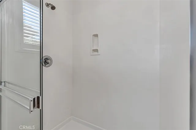 a house with yard and a trees in front of it