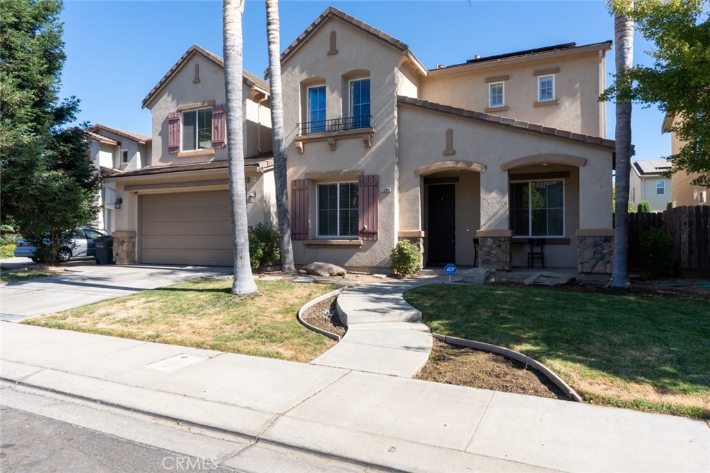 1289 Verdon Court Merced, CA 95348 - Photo 5 of 56 a front view of a house with garden
