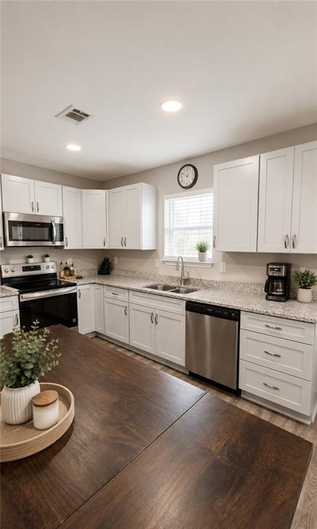 2956 Westmoreland Road Cleveland, GA 30528 - Photo 7 of 22 a kitchen with a white stove top oven and white cabinets