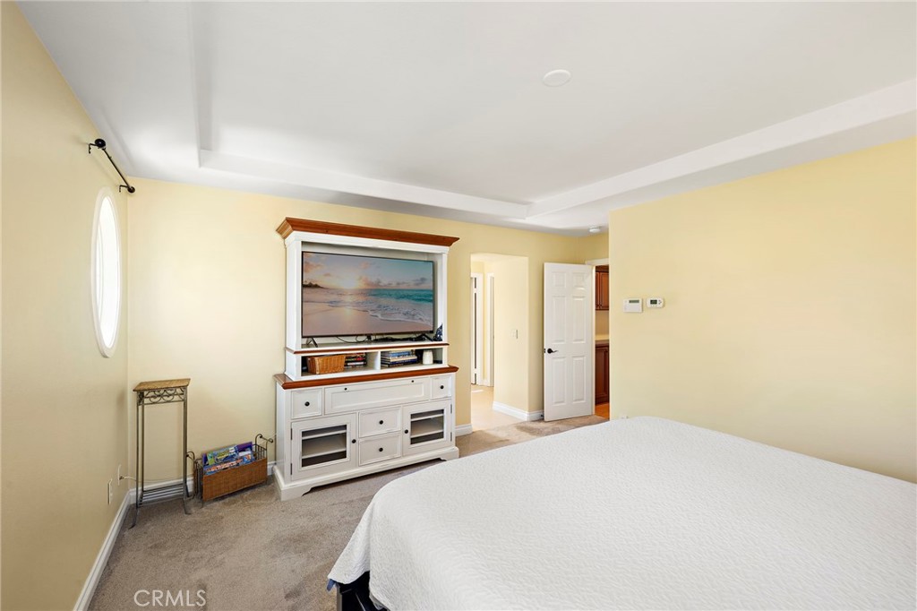 8 Earthen Court Ladera Ranch, CA 92694 - Photo 18 of 58 a bedroom with a bed and a television