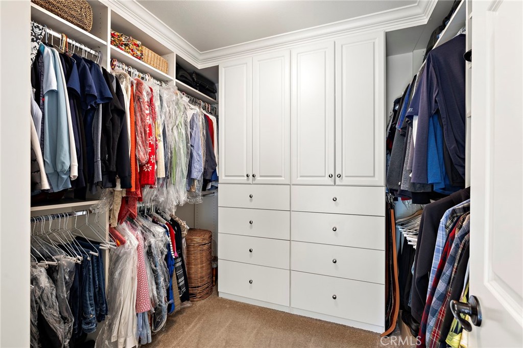 8 Earthen Court Ladera Ranch, CA 92694 - Photo 23 of 58 a view of walk in closet with clothes