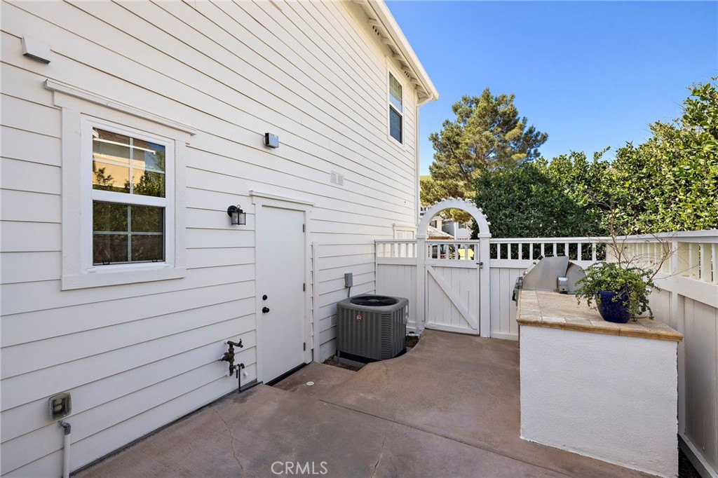8 Earthen Court Ladera Ranch, CA 92694 - Photo 30 of 58 a view of a deck with couches under an umbrella