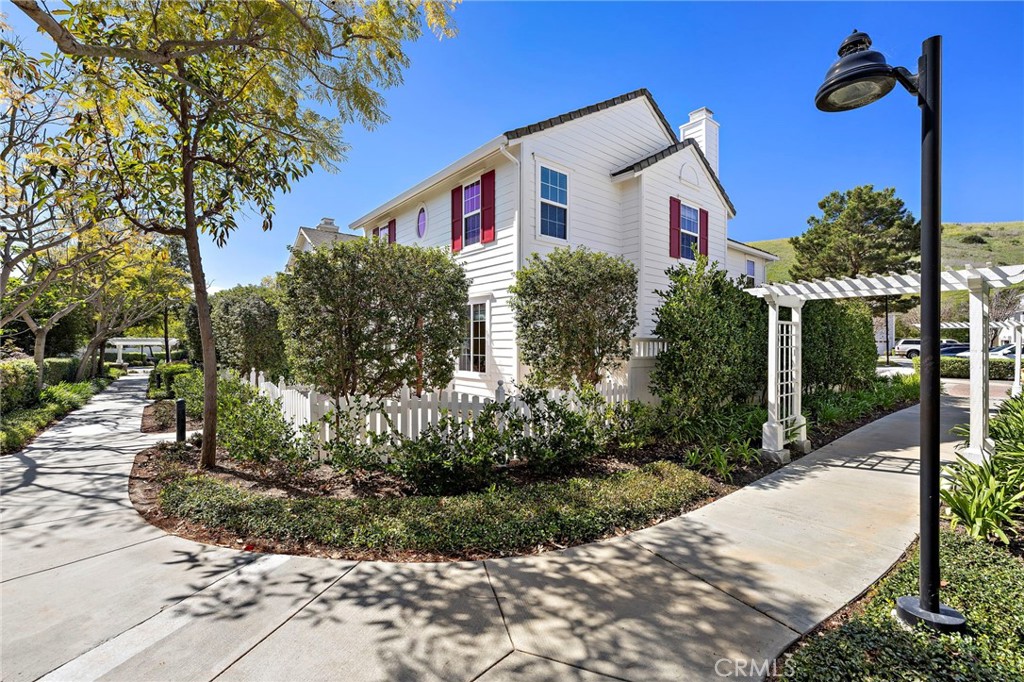 8 Earthen Court Ladera Ranch, CA 92694 - Photo 40 of 58 a front view of a house with a yard and tree s