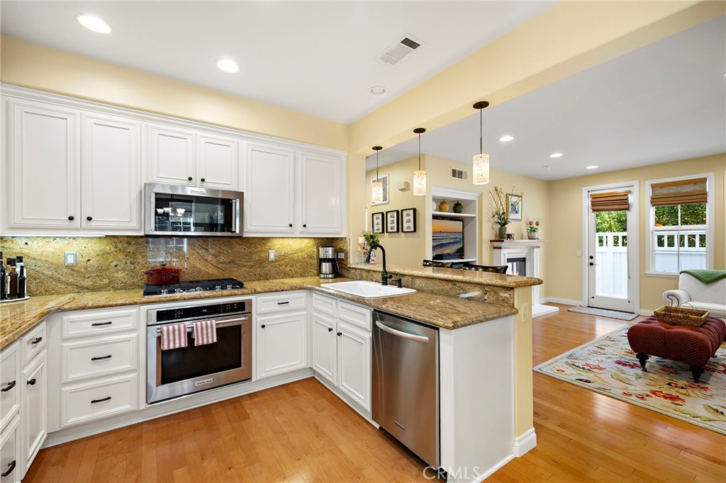 8 Earthen Court Ladera Ranch, CA 92694 - Photo 10 of 58 a kitchen with a stove and a sink