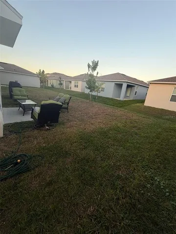 a view of a terrace with a yard