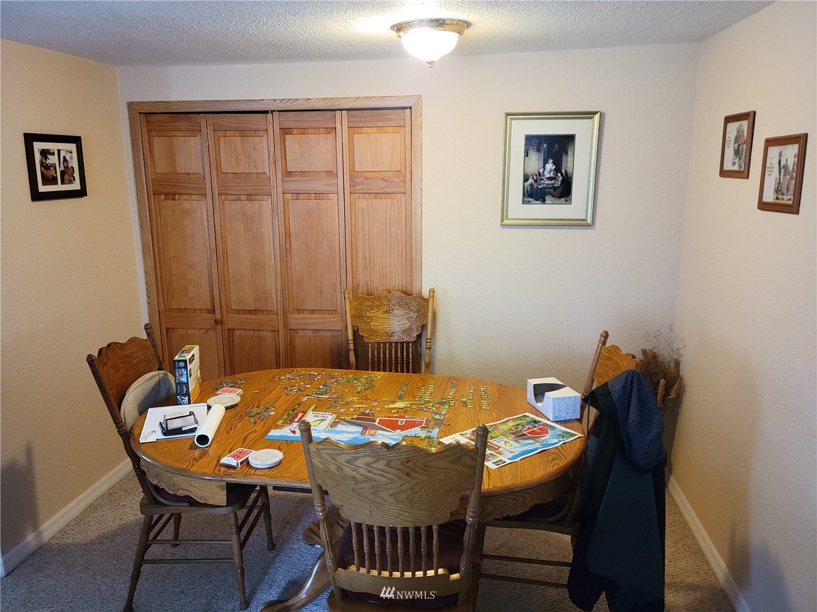 231 Monroe Road Winlock, WA 98596 - Photo 21 of 24 a view of a dining room with furniture and wooden floor