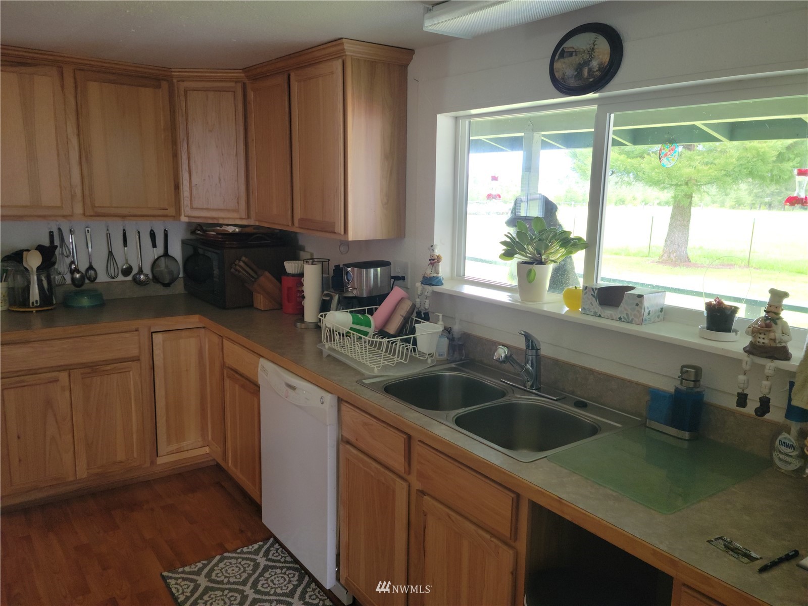 231 Monroe Road Winlock, WA 98596 - Photo 10 of 24 a kitchen with a sink cabinets and window