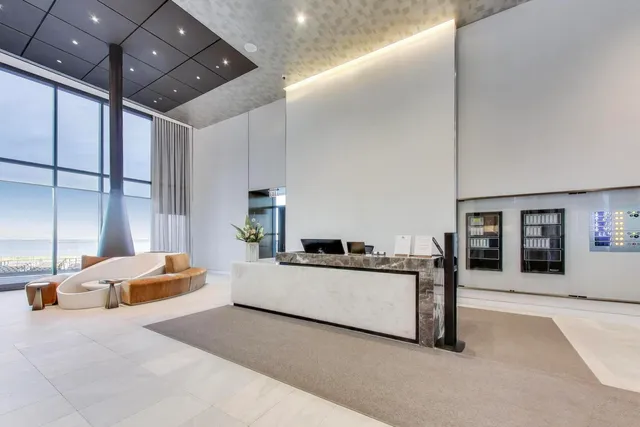 a kitchen with a sink a counter top space cabinets and stainless steel appliances