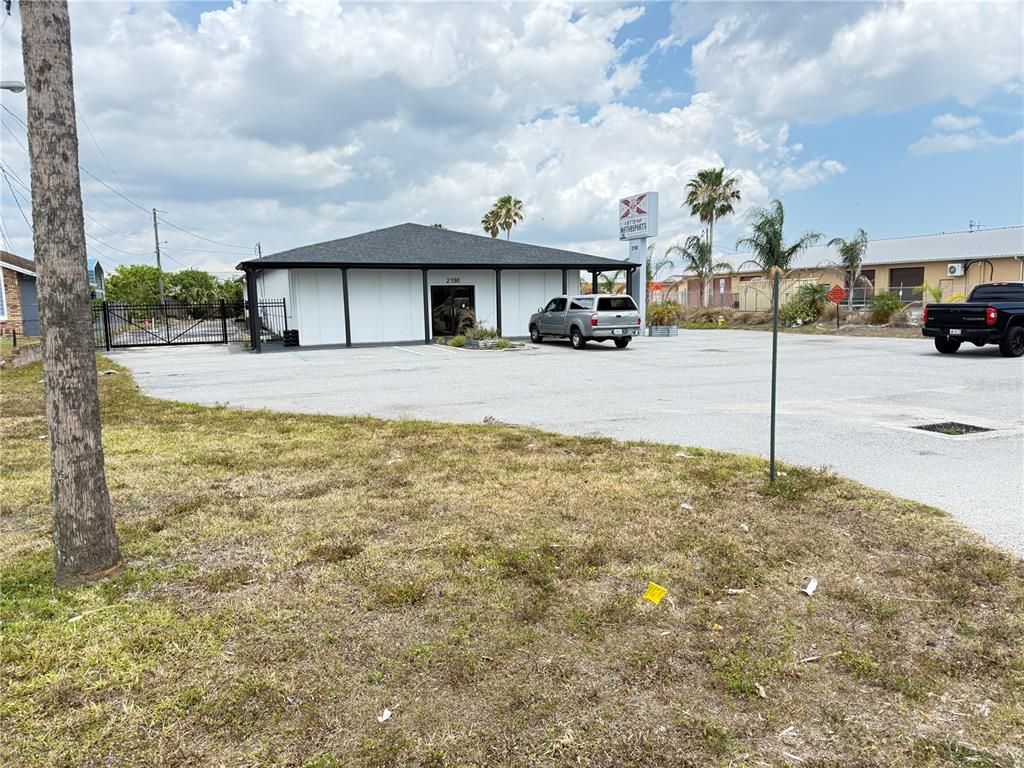 2130 West King Street Cocoa, FL 32926 - Photo 16 of 20 a view of a house with truck parked on the road