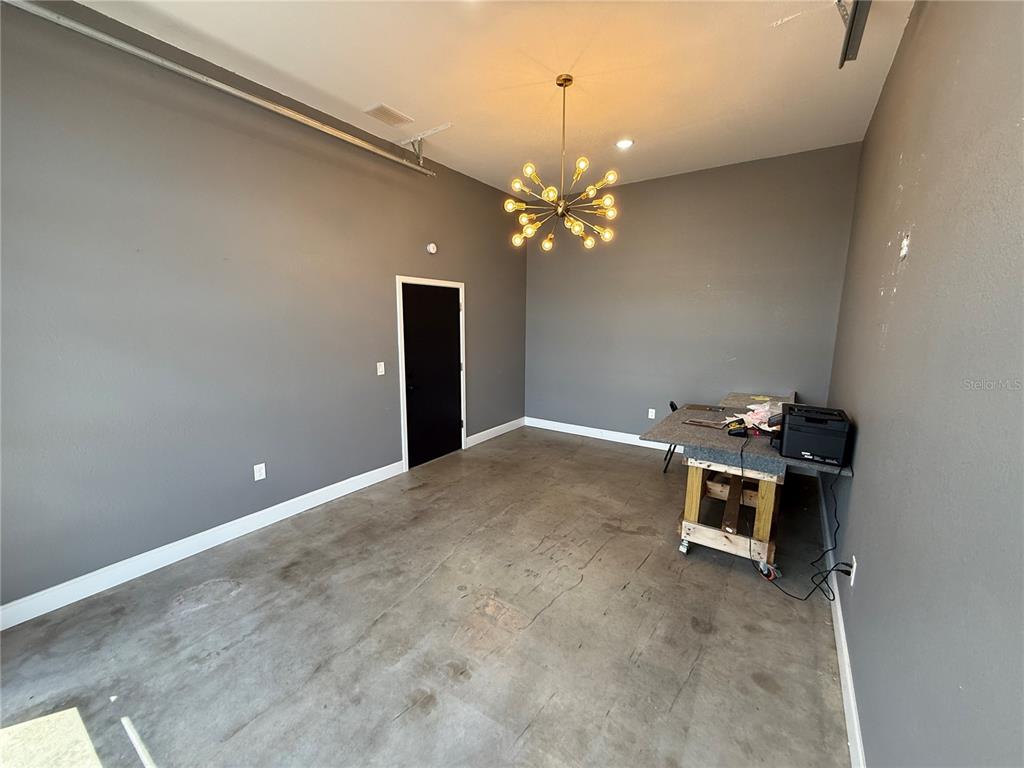 2130 West King Street Cocoa, FL 32926 - Photo 20 of 20 a view of a room with a chandelier