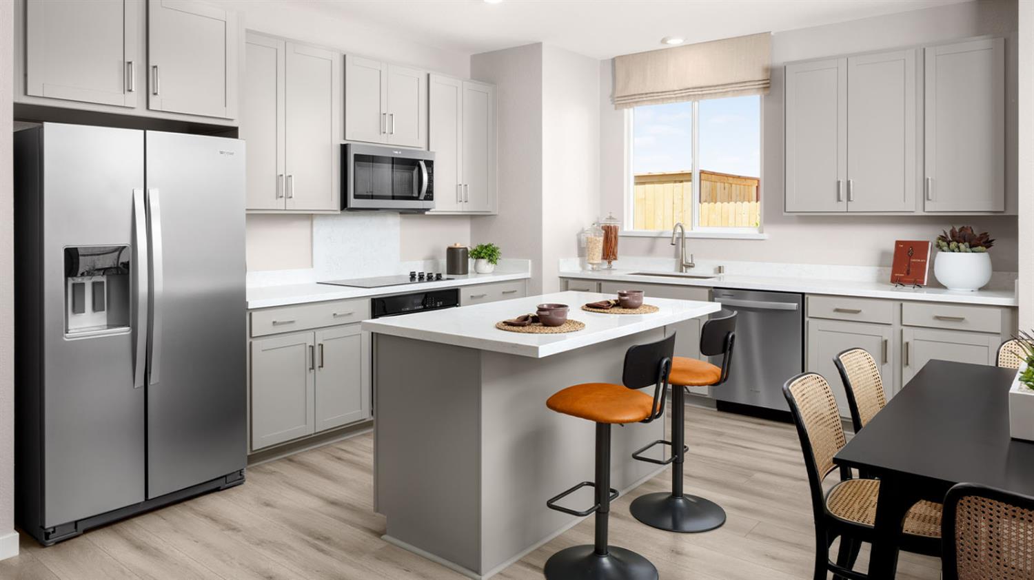 2922 Porcelain Street Lincoln, CA 95648 - Photo 2 of 14 a kitchen with stainless steel appliances granite countertop a sink a stove a refrigerator cabinets and chairs